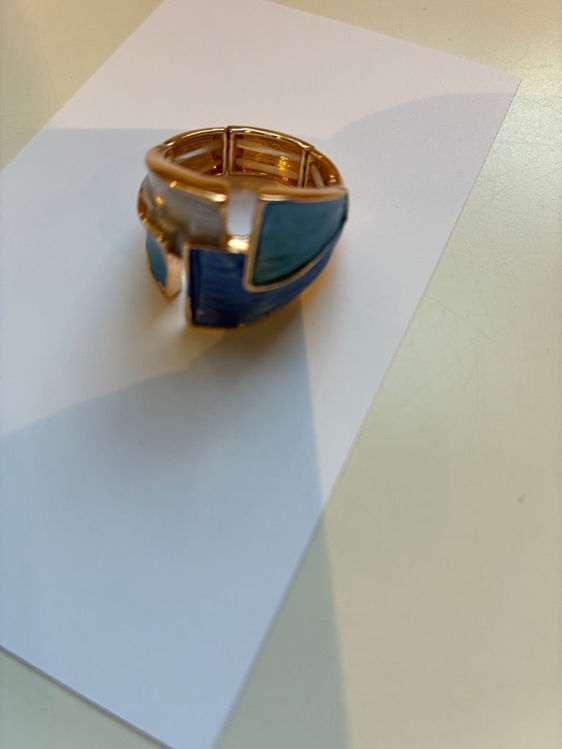 Billede af Gylden ring med blå og hvid sten
